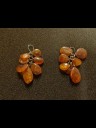 Earrings in silver with polished pieces of amber